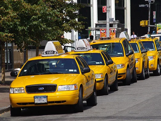 Yellow cabs lined up on a New York City street